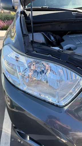 Clear, restored SUV headlight after restoration